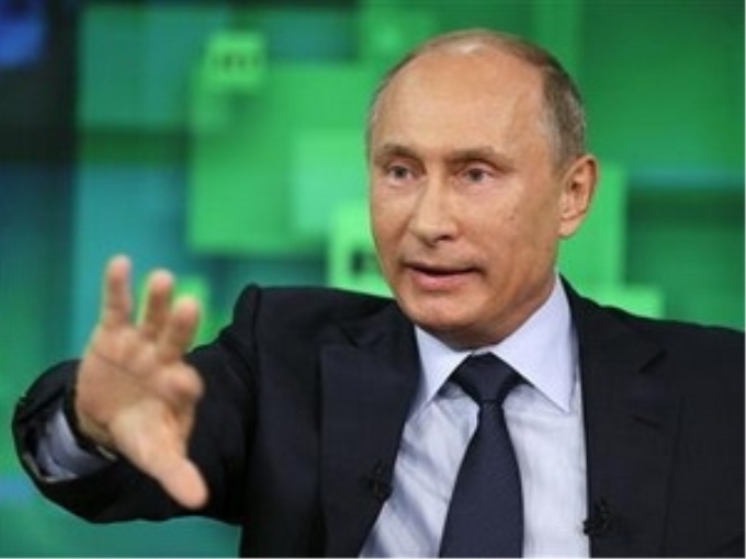 Tổng thống Vladimir Putin phát biểu trên kênh truyền hình Russia Today. (Nguồn: Reuters)