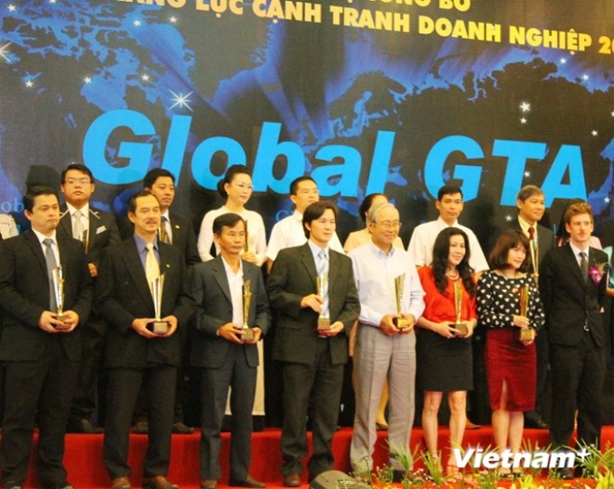 115 doanh nghiệp nhận thương hiệu “Top Brands 2014.” (Ảnh: Trần Xuân Tình/Vietnam+)