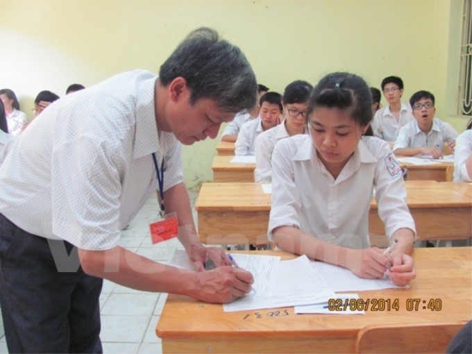 Thí sinh dự thi tốt nghiệp trung học phổ thông năm 2014. (Ảnh: Vietnam+)