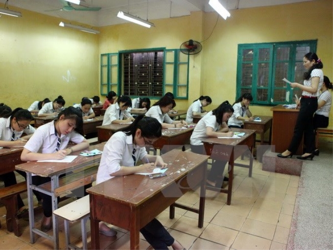 Thí sinh làm bài tại Kỳ thi tốt nghiệp THPT năm học 2013-2014. (Ảnh: Quý Trung/TTXVN)