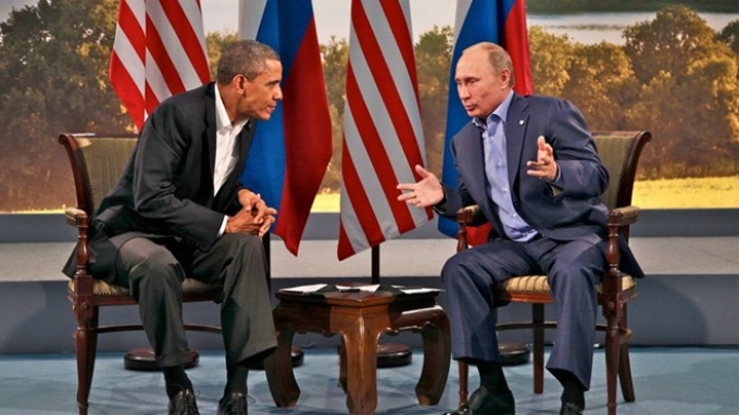 Tổng thống Nga Vladimir Putin và người đồng cấp Mỹ Barack Obama. (Nguồn: EPA)