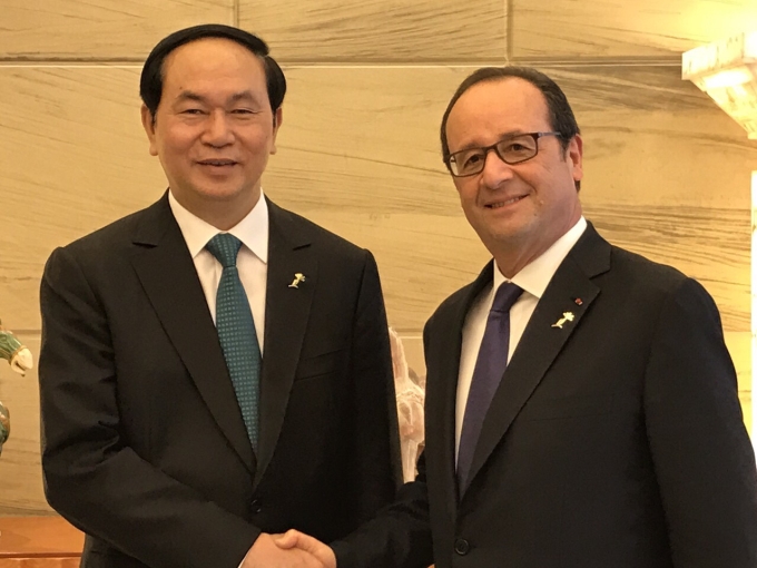 Chủ tịch nước Trần Đại Quang và Tổng thống Pháp Francois Hollande. Ảnh: BNG