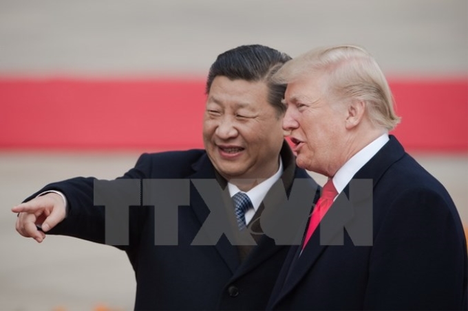 Chủ tịch Trung Quốc Tập Cận Bình (trái) và Tổng thống Mỹ Donald Trump tại lễ đón ở Bắc Kinh ngày 9/11. (Ảnh: AFP/TTXVN)