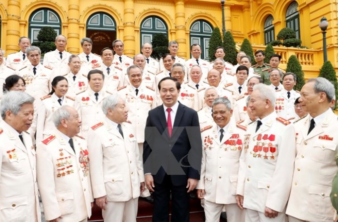 Chủ tịch nước Trần Đại Quang gặp mặt thân mật Đoàn đại biểu Ban liên lạc Cán bộ công an chi viện chiến trường miền Nam thời kỳ kháng chiến chống Mỹ, cứu nước. (Ảnh: TTXVN)