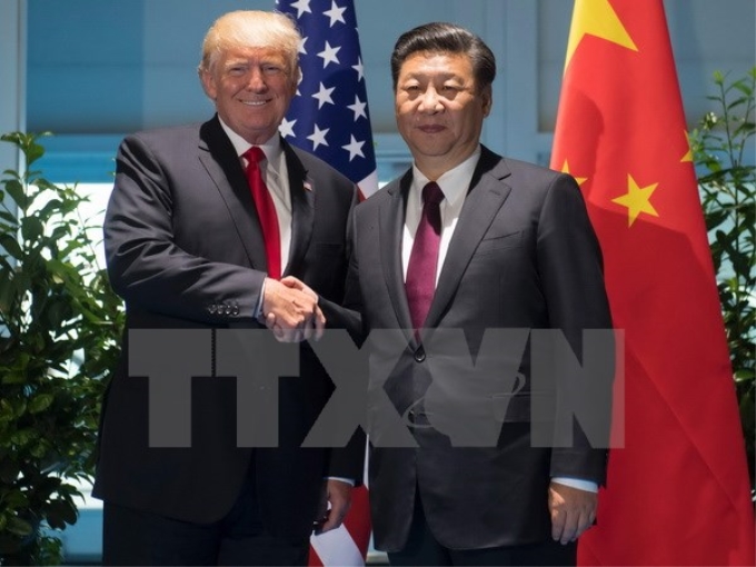 Chủ tịch Trung Quốc Tập Cận Bình và Tổng thống Mỹ Donald Trump. (Ảnh: AFP/TTXVN)