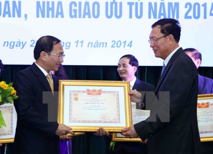 Lễ trao tặng danh hiệu Nhà giáo Nhân dân, Nhà giáo ưu tú năm 2014. (Ảnh: TTXVN)