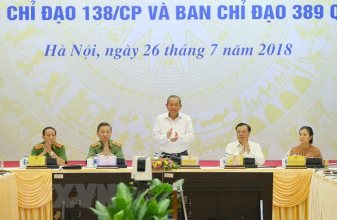 Phó Thủ tướng Thường trực Chính phủ Trương Hòa Bình (giữa), Trưởng Ban Chỉ đạo 138/CP, Trưởng BCĐ 389 chủ trì hội nghị. (Ảnh: Doãn Tấn/TTXVN)