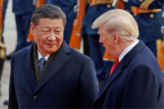 Tổng thống Mỹ Donald Trump (phải) và Chủ tịch Trung Quốc Tập Cận Bình trong cuộc gặp tại Bắc Kinh năm 2017. Ảnh: Reuters.