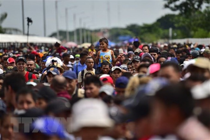 Người di cư tại khu vực Ciudad Hidalgo, bang Chiapas, Mexico, trong hành trình tới Mỹ. (Ảnh: AFP/TTXVN)