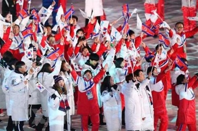 Các vận động viên Hàn Quốc và Triều Tiên tại lễ bế mạc Olympic PyeongChang 2018. (Nguồn: Kyodo/TTXVN)