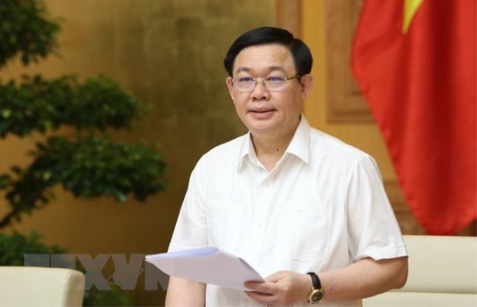 Phó Thủ tướng Vương Đình Huệ, Trưởng Ban Chỉ đạo phòng, chống rửa tiền chủ trì cuộc họp. (Ảnh: Dương Giang/TTXVN)