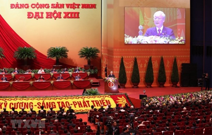 Tổng Bí thư Ban Chấp hành Trung ương Đảng Nguyễn Phú Trọng đọc Báo cáo chính trị của Ban Chấp hành Trung ương Đảng khóa XII và các văn kiện trình Đại hội Đảng XIII. (Ảnh: TTXVN)