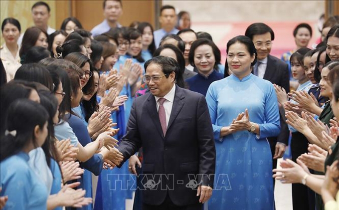 Thủ tướng Phạm Minh Chính đến dự hội nghị “Thúc đẩy bình đẳng giới và phát huy vai trò của phụ nữ trong phát triển kinh tế - xã hội” diễn ra sáng 15/10/2022. Ảnh: Dương Giang/TTXVN