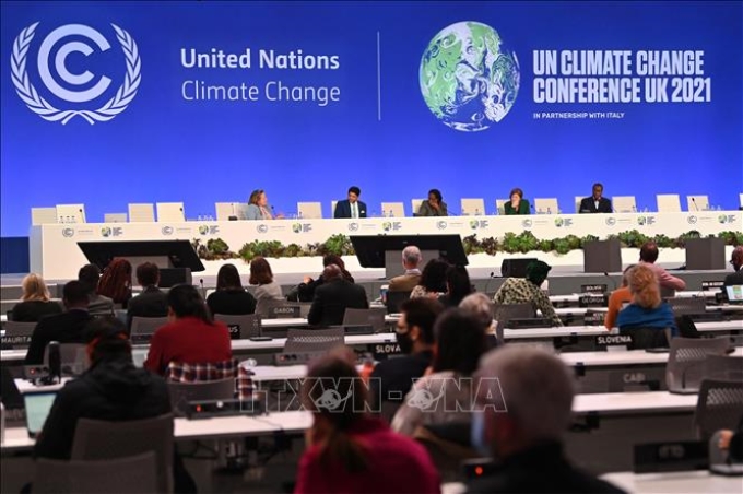Các đại biểu tại một phiên thảo luận trong khuôn khổ Hội nghị lần thứ 26 Các bên tham gia Công ước khung của Liên hợp quốc về biến đổi khí hậu (COP26) tại Glasgow, Anh, ngày 5/11/2021. Ảnh: AFP/TTXVN