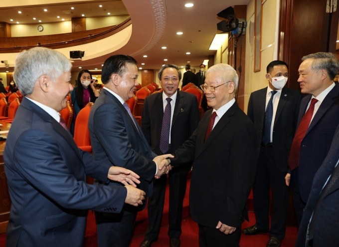 Tổng Bí thư Nguyễn Phú Trọng cùng các đồng chí lãnh đạo Đảng, Nhà nước và các đại biểu dự Hội nghị lần thứ ba Ban Chấp hành Trung ương Đảng khóa XIII. (Ảnh: TTXVN)