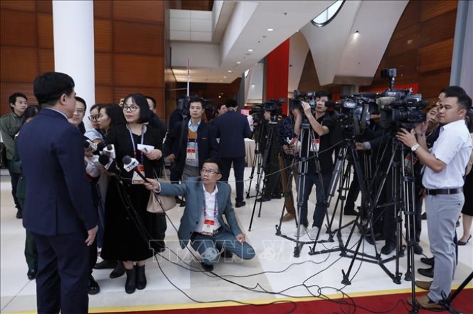 Sáng 26/1/2021, gần 500 phóng viên trong nước và quốc tế đã tham dự, đưa tin trực tiếp phiên khai mạc Đại hội XIII của Đảng tại Trung tâm Hội nghị Quốc gia (Hà Nội). Ảnh: TTXVN