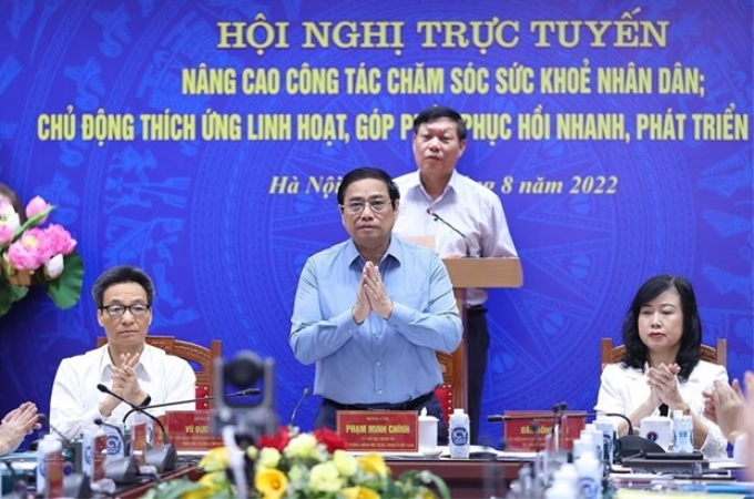 Thủ tướng Phạm Minh Chính chủ trì hội nghị trực tuyến toàn quốc về công tác nâng cao công tác chăm sóc sức khỏe nhân dân. (Ảnh: Dương Giang/TTXVN