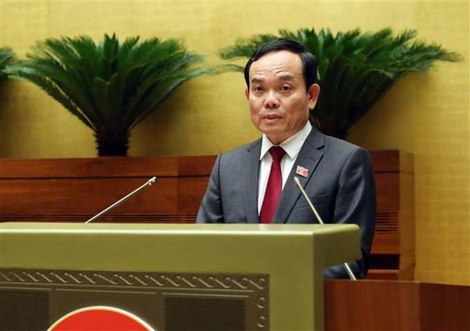 Phó Thủ tướng Trần Lưu Quang báo cáo tại phiên họp sáng 6/11. Ảnh: Doãn Tấn/TTXVN