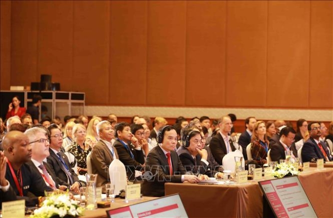 Phó Thủ tướng Chính phủ Trần Lưu Quang cùng các đại biểu trong và ngoài nước tham dự Hội nghị. Ảnh: Vũ Sinh/TTXVN