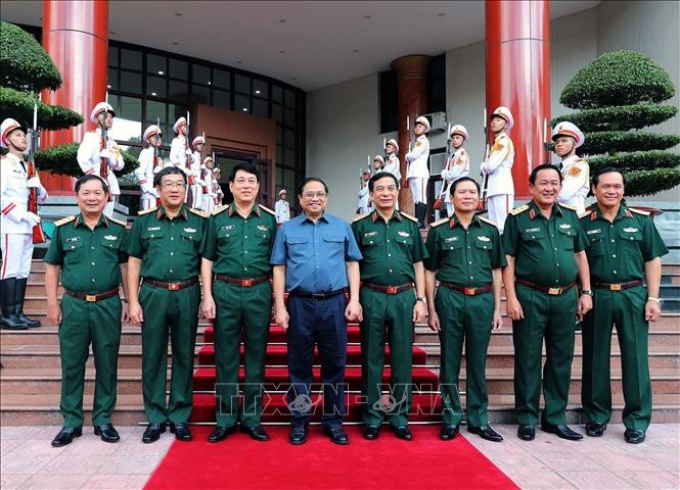 Thủ tướng Phạm Minh Chính và các đồng chí lãnh đạo Bộ Quốc phòng dự hội nghị. Ảnh: Trọng Đức/TTXVN