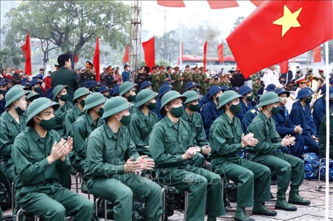 Tân binh huyện Gia Lâm phấn khởi lên đường nhập ngũ, sáng 6/2/2023. Ảnh tư liệu: An Đăng/TTXVN