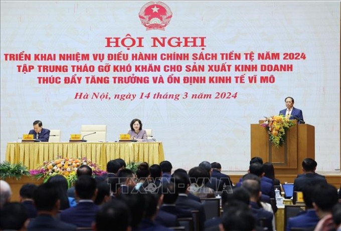 Thủ tướng Phạm Minh Chính phát biểu chỉ đạo Hội nghị triển khai nhiệm vụ điều hành chính sách tiền tệ năm 2024. (Ảnh: TTXVN)