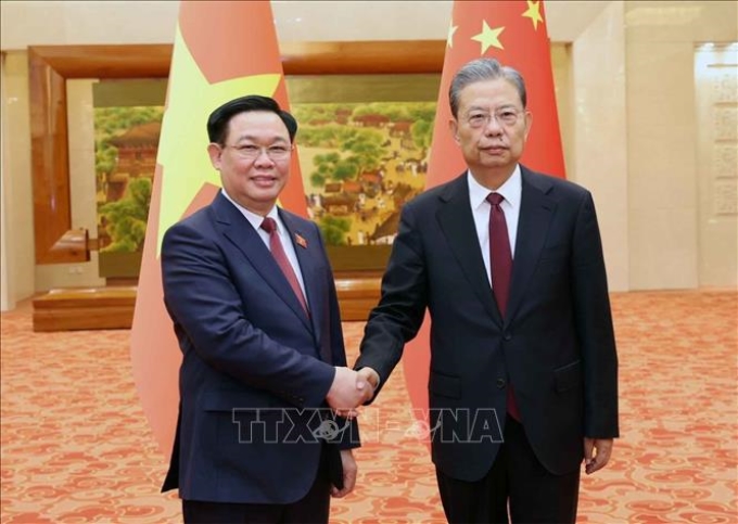 Chủ tịch Quốc hội Vương Đình Huệ và Uỷ viên trưởng Uỷ ban Thường vụ Nhân đại toàn quốc Trung Quốc Triệu Lạc Tế - Ảnh: TTXVN