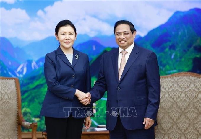 Thủ tướng Phạm Minh Chính tiếp Bộ trưởng Tư pháp Trung Quốc Hạ Vinh. (Ảnh: TTXVN)