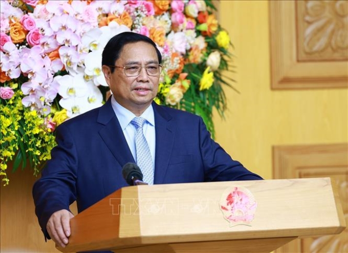 Thủ tướng Phạm Minh Chính tọa đàm với các doanh nghiệp Trung Quốc tiêu biểu trong lĩnh vực phát triển kinh tế xanh, kinh tế số. Ảnh: Dương Giang/TTXVN