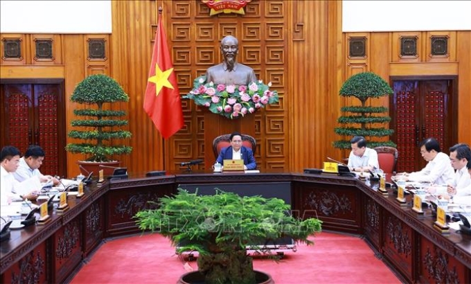 Thủ tướng Phạm Minh Chính chủ trì cuộc họp về chính sách tài khoá. (Ảnh: TTXVN)