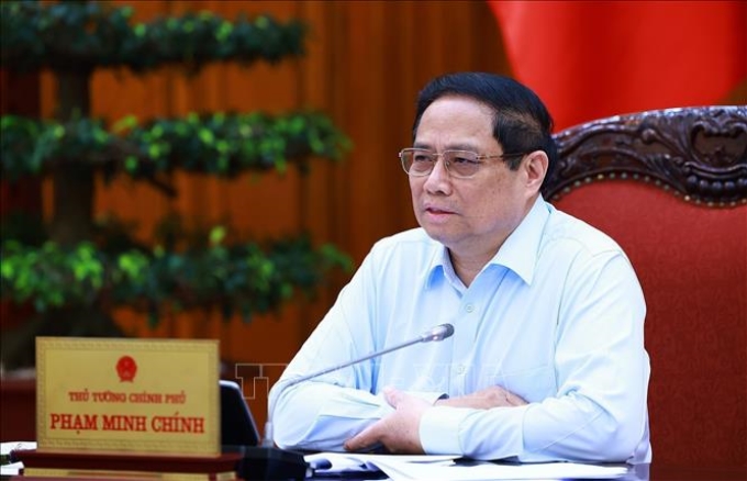 Thủ tướng Phạm Minh Chính chủ trì họp thúc đẩy tiến độ triển khai dự án đường dây 500kV mạch 3 và cung ứng điện tháng cao điểm. (Ảnh: TTXVN)
