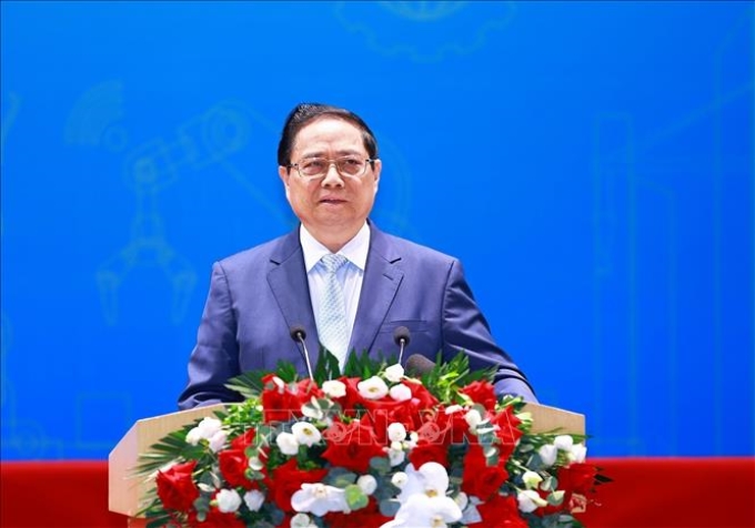 Thủ tướng Phạm Minh Chính phát biểu tại Diễn đàn nâng cao năng suất lao động quốc gia năm 2024. (Ảnh: TTXVN)