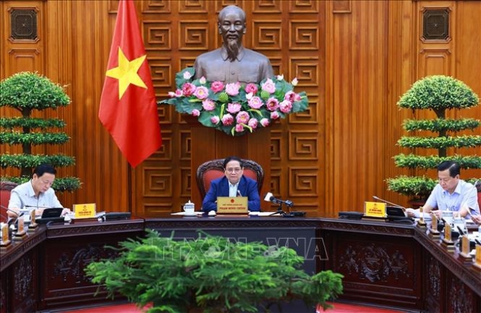 Thủ tướng Phạm Minh Chính chủ trì họp Thường trực Chính phủ về kiểm soát lạm phát. (Ảnh: TTXVN)
