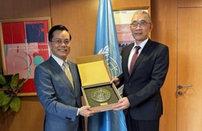 Thứ trưởng Ngoại giao Hà Kim Ngọc gặp và làm việc với Phó Tổng Giám đốc UNESCO kiêm Trợ lý Tổng Giám đốc về Quan hệ đối ngoại và Ưu tiên Châu Phi Xing Qu. (Ảnh: TTXVN)