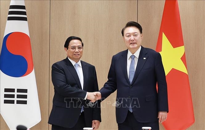 Thủ tướng Phạm Minh Chính hội kiến Tổng thống Hàn Quốc Yoon Suk Yeol. (Ảnh: TTXVN)