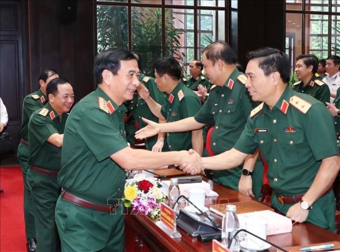 Đại tướng Phan Văn Giang, Bộ trưởng Bộ Quốc phòng và các đại biểu dự hội nghị. (Ảnh: TTXVN)